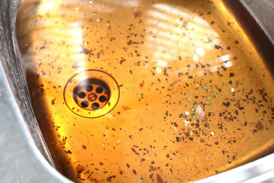 Kitchen sink filled with water because of clogged drain