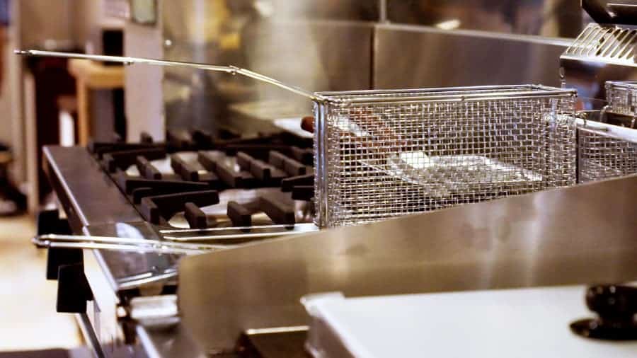 Kitchen stove and fryer baskets in commercial kitchen
