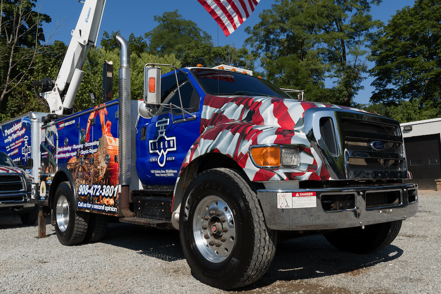 The front of an arrow sewer and drain truck